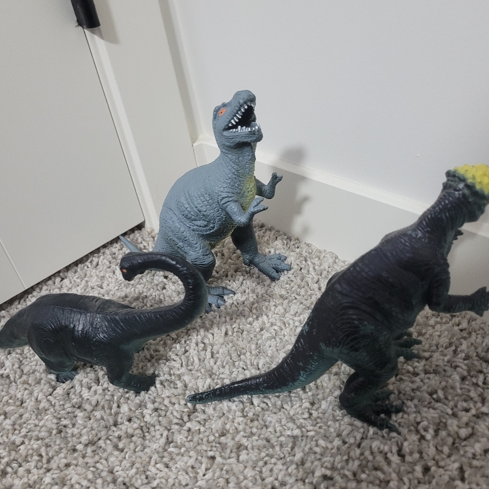 3 plastic dinos
